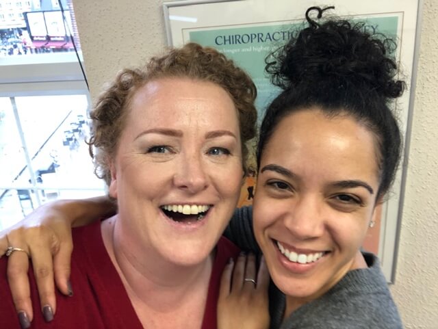 Kelly with a happy patient after chiropractic treatment