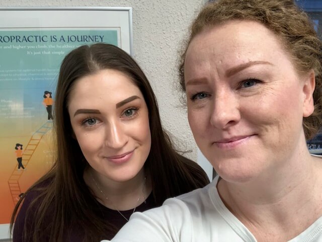 Kelly with a happy patient at the clinic